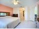 Spacious main bedroom with tile flooring and ensuite bath at 2609 Waterford Way # B, Palmetto, FL 34221