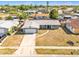Aerial view of home with a well-maintained yard in a peaceful neighborhood at 2705 20Th Avenue W Dr, Bradenton, FL 34205