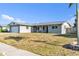 Charming single-story home with a well-kept lawn and attached garage at 2705 20Th Avenue W Dr, Bradenton, FL 34205
