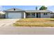 Inviting single-Gathering home featuring a neatly maintained front yard and attached garage at 2705 20Th Avenue W Dr, Bradenton, FL 34205