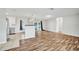 Open-concept layout connecting the kitchen and living room with modern flooring at 2705 20Th Avenue W Dr, Bradenton, FL 34205