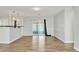 Modern living area showcases wood-look floors and transitions to a bright patio at 2705 20Th Avenue W Dr, Bradenton, FL 34205