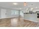 Bright open concept living and dining area with wood floors and neutral decor at 2705 20Th Avenue W Dr, Bradenton, FL 34205