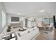 Bright, open-concept living and dining area with hardwood floors and modern furniture at 2705 20Th Avenue W Dr, Bradenton, FL 34205