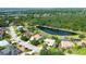 Gorgeous aerial view of the property, backing to a peaceful pond and surrounding community at 3201 Wilderness W Blvd, Parrish, FL 34219