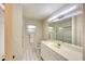 Bright bathroom featuring white vanity and tile flooring, and shower with glass doors at 3201 Wilderness W Blvd, Parrish, FL 34219