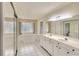 Spacious bathroom features double vanity, large mirror, and separate tub and shower at 3201 Wilderness W Blvd, Parrish, FL 34219