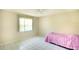 Bright bedroom featuring tile flooring, a window, and a ceiling fan at 3201 Wilderness W Blvd, Parrish, FL 34219