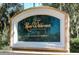 Elegant community sign for River Wilderness Golf & Country Club with lush landscaping at 3201 Wilderness W Blvd, Parrish, FL 34219