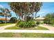 Well-maintained lawn and mature landscaping highlight this beautiful property at 3201 Wilderness W Blvd, Parrish, FL 34219