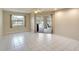 Bright living room featuring tile flooring, a ceiling fan, and access to the pool area at 3201 Wilderness W Blvd, Parrish, FL 34219