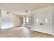 Spacious living room featuring neutral walls, large windows, and tile floors at 3201 Wilderness W Blvd, Parrish, FL 34219