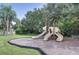 Community playground with slides, picnic tables and plenty of shade trees at 3201 Wilderness W Blvd, Parrish, FL 34219