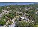 Aerial view of the property showcasing the surrounding neighborhood with lush landscaping near the water at 3209 2Nd W Ave, Bradenton, FL 34205