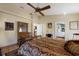 Bedroom with decorative furnishings, an antique desk, terra cotta flooring, and access to bathroom at 3209 2Nd W Ave, Bradenton, FL 34205