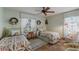 Charming bedroom with twin beds, quaint decor, and tile flooring providing a cozy feel at 3209 2Nd W Ave, Bradenton, FL 34205