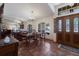 Elegant dining area with chandelier lighting and views to front door and living room at 3209 2Nd W Ave, Bradenton, FL 34205
