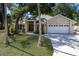 Charming single Gathering home with stone accents, double front doors and a lush green lawn at 3209 2Nd W Ave, Bradenton, FL 34205