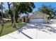 Charming single Gathering home with stone accents, double front doors and a lush green lawn at 3209 2Nd W Ave, Bradenton, FL 34205