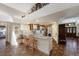 Open kitchen area featuring an eat-in bar, terra cotta tile floors, white cabinets, and an open design at 3209 2Nd W Ave, Bradenton, FL 34205
