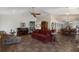Spacious living area with tile flooring, piano and a view into the dining area and kitchen at 3209 2Nd W Ave, Bradenton, FL 34205