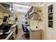 Functional office space with built-in shelving and laminate wood flooring at 3209 2Nd W Ave, Bradenton, FL 34205