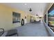 Inviting screened porch with ceiling fans and outdoor seating, overlooking the backyard at 3209 2Nd W Ave, Bradenton, FL 34205