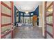 Stunning foyer with high ceilings, chandelier, and herringbone tile floors at 3302 Sabal Cove Ln, Longboat Key, FL 34228