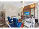 Bright living room with a fireplace, bar and a wall of windows bringing in tons of natural light at 3302 Sabal Cove Ln, Longboat Key, FL 34228