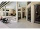 Inviting outdoor patio with comfortable seating, outdoor kitchen, and scenic views of the manicured backyard at 3302 Sabal Cove Ln, Longboat Key, FL 34228