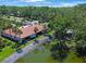 Wonderful aerial view of condo near pond with lovely greenery and a rock wall at 3500 El Conquistador Pkwy # 301, Bradenton, FL 34210