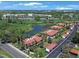 A beautiful aerial view of the condo and surrounding landscaping, close to a golf course at 3500 El Conquistador Pkwy # 301, Bradenton, FL 34210