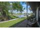 Backyard features lush landscaping and a beautiful view of a lake and golf course at 3500 El Conquistador Pkwy # 301, Bradenton, FL 34210
