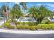 The Valencia community sign is surrounded by lush tropical landscaping at 3500 El Conquistador Pkwy # 301, Bradenton, FL 34210