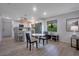 Open concept kitchen features an island, stainless steel appliances, and breakfast table at 3500 El Conquistador Pkwy # 301, Bradenton, FL 34210