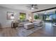 Living room with comfortable seating and great light from the large windows at 3500 El Conquistador Pkwy # 301, Bradenton, FL 34210