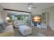 Living room with access to the outside and a view to a dining room at 3500 El Conquistador Pkwy # 301, Bradenton, FL 34210