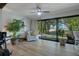Indoor-outdoor living area featuring large windows with access to a porch at 3500 El Conquistador Pkwy # 301, Bradenton, FL 34210