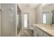 Bathroom featuring tile flooring, granite countertops, walk-in shower and modern lighting at 3608 Avenida Madera, Bradenton, FL 34210