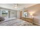 Bedroom featuring two twin beds, a large window and a wood dresser with a mirror at 3608 Avenida Madera, Bradenton, FL 34210