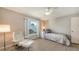 Well-lit bedroom with a ceiling fan, laminate flooring and large windows at 3608 Avenida Madera, Bradenton, FL 34210