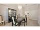 Elegant dining room with a contemporary chandelier and stylish furniture, creating a sophisticated ambiance for meals at 3608 Avenida Madera, Bradenton, FL 34210