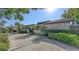 A well-maintained front yard with mature trees and manicured bushes, enhancing the property's charm and curb appeal at 3608 Avenida Madera, Bradenton, FL 34210