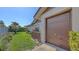 Home exterior showcasing garage and landscaping with garden, plants, and well-maintained lawn at 3608 Avenida Madera, Bradenton, FL 34210