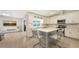 Bright kitchen features island with seating, modern appliances, and an open layout leading to the living area at 3608 Avenida Madera, Bradenton, FL 34210