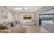 Bright living room features a sliding door to the pool and a comfortable seating arrangement at 3608 Avenida Madera, Bradenton, FL 34210