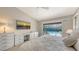 Comfortable primary bedroom featuring patio access to pool area and calming modern decor at 3608 Avenida Madera, Bradenton, FL 34210