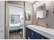 Bathroom with double sink vanity, stylish fixtures and gray paint at 3750 Pinebrook Cir # 104, Bradenton, FL 34209