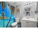 Bathroom featuring a toilet, a shower with a tropical themed curtain, and a single sink vanity at 3750 Pinebrook Cir # 104, Bradenton, FL 34209