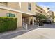 Welcoming entrance to condo building, featuring a well-maintained facade and convenient parking at 3750 Pinebrook Cir # 104, Bradenton, FL 34209